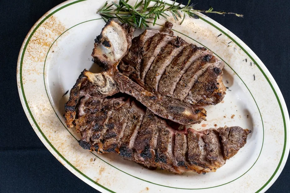 Sliced porterhouse steak with rosemary